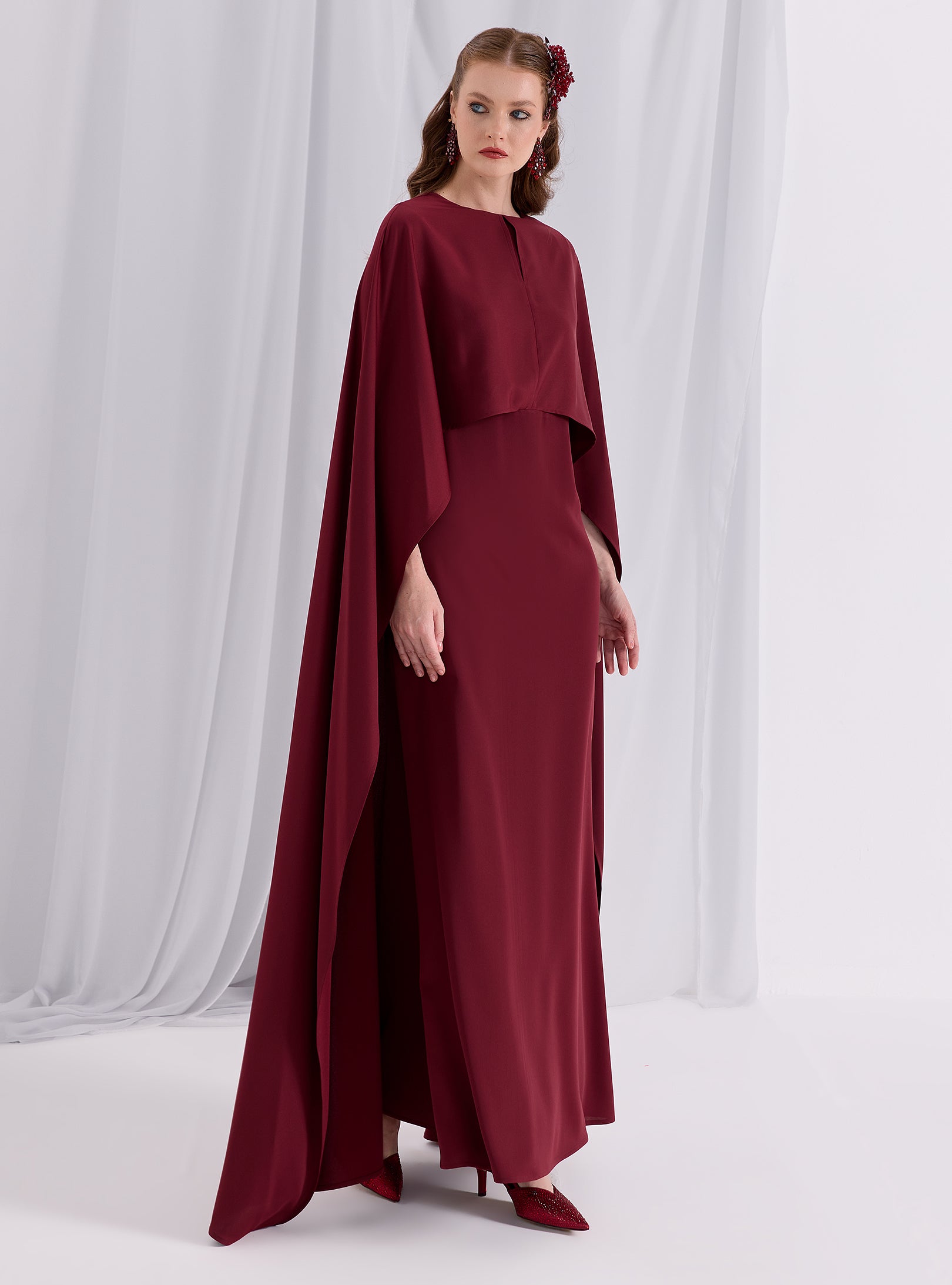 cape for a dress Aurora Gown Teuta Matoshi while the fitted bodice flatters your figure beautifully Burgundy Evenin out Cape Dress